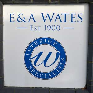 305. Metal wall sign at E & A Wates