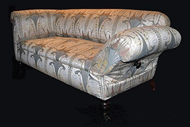 Drop arm Chesterfield early c20th covered in an elegant Art Nouveau design jacquard.